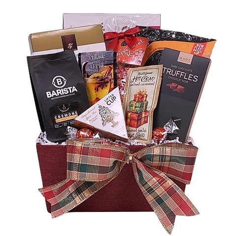 Warm them up with this basket loaded with specialty coffee, tea, hot chocolate and cider along with truffles, cookies & biscotti to enjoy. Sure to warm the heart on a cold winter day.  