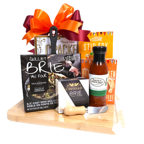 A classy design of gourmet specialties loaded on our gourmet board. There's a cast iron brie baker with topping mix, asparagus dipping sauce, cheese, stir fry and chicken spice mixes and crackers too!  A real gourmet pleaser! 
