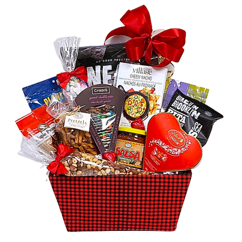 basket filled with nachos, salsa, nuts, chocolate, pretzels, chocolate pizza and more