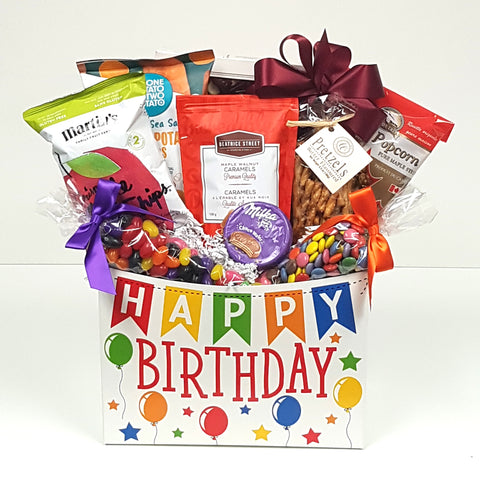 The perfect birthday gift basket brimming with birthday wishes of all sorts and loads of sweet and salty treats.