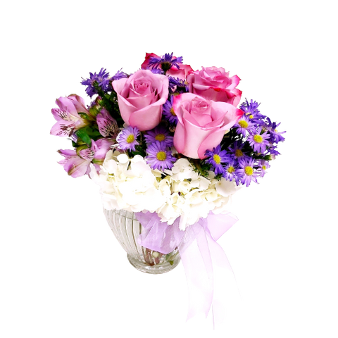 A dream to receive and enjoy, this pretty vase holds a soft palette of pinks, lavenders and whites to send soft & soothing sentiments.