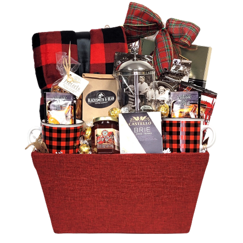 Perfect for a Holiday Get Away. This basket is loaded with everything needed to cozy up for the Holidays. There's a warm and cozy blanket, coffee, coffee press, coffee mugs, cider mix, crackers and cheese, red pepper jelly and some sweet treats too!
