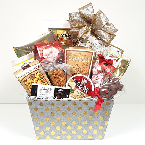 Some of Dasher's favourites are all nestled inside. He loves crackers and cheese, lots of chocolates, pretzels, nuts, snack mix, candy and cookies too! Basket design may vary.