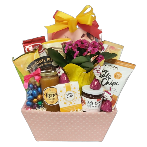 This pretty pastel Easter gift basket is brimming with loads of delights to savour. There's chocolates, cookies, Innisfil Creek honey, Lifted Cup tea, apple chips, crackers, chocolate pizza, jam and more along with a pretty plant to enjoy once all the treats are gone!