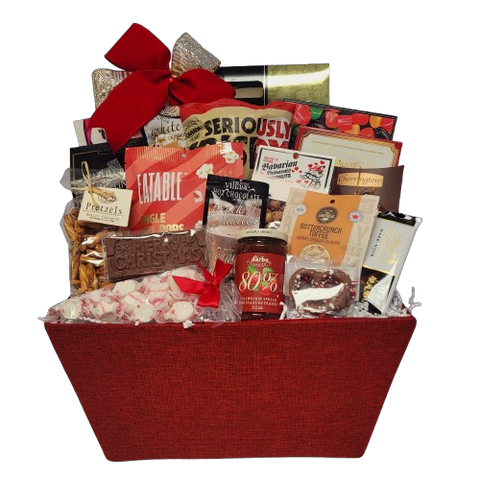 Home for the Holidays is the best place to be! Indulge them with all the tasty treats in this overflowing gift basket of goodies. They'll enjoy brittle, hot chocolate, pretzels, delicious chocolate treats, popcorn and chips, exquisite biscuits, specialty candy mixes, hot chocolate and gourmet jam too!