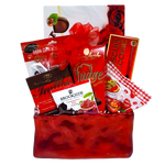 A sweet gift basket to say "I'm Yours"! Filled with all sorts of sweet treats to enjoy. There's chocolate covered pretzels, truffles, jelly beans, fudge and biscuits too!