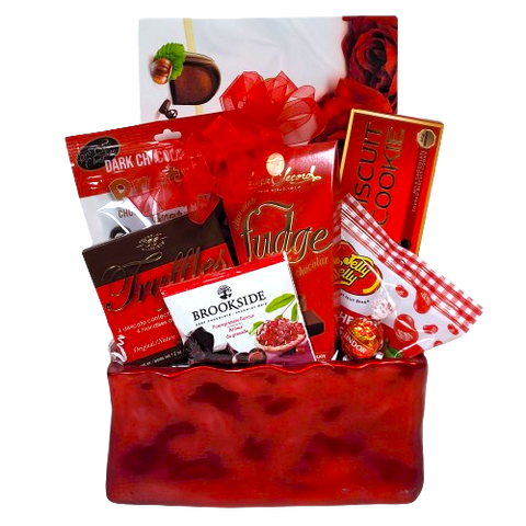 A sweet basket to say "Im Yours"! Filled with all sorts of sweet treats to enjoy. There's chocolate covered pretzels, truffles, jelly beans, fudge and biscuits too!