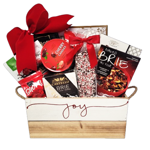 Send some joy with this beautifully crafted wooden gift basket loaded with crackers and cheese, Brie topping mix, truffles and chocolate, candies, chocolate covered treats, shortbread and wafers too.