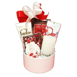 Send your love with this beautiful basket featuring fudge, truffles, chocolate bark, a relaxing shower steamer, a fragrant sachet and a Botanico candle to create the perfect ambiance.