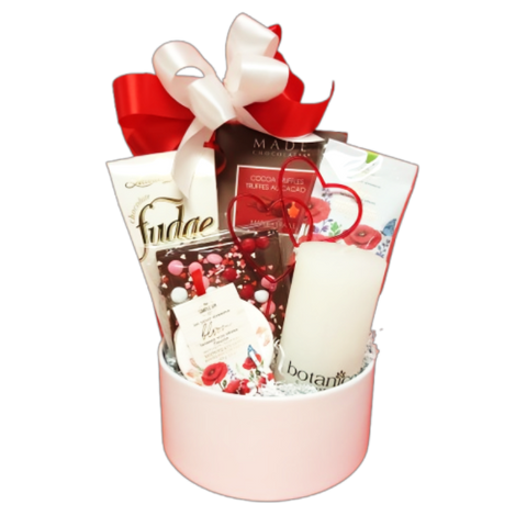 Send your love with this beautiful basket featuring fudge, truffles, chocolate bark, a relaxing shower steamer, a fragrant sachet and a Botanico candle to create the perfect ambiance.