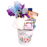 Mother's Day gift basket of sweet treats and bath indulgences.