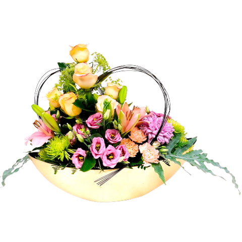 For those special golden moments, send this pretty gold half moon filled with lush roses, lilies and more in soft hues of pinks, lavender and blush nestled amongst beautiful greens.