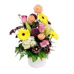 Beautiful blooms of ranunculus, gerbera, hydrangea, roses, mums and lilies all nestled in a beautiful pot with gold etching. Lush and full, this one is sure to please!