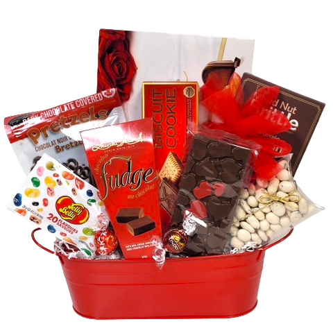 Explore an array of delectable treats, perfectly nestled within this gift basket. Savor pretzels, peanut brittle, jelly beans, fudge, cookies and more - a delightful way to celebrate Valentine's Day!