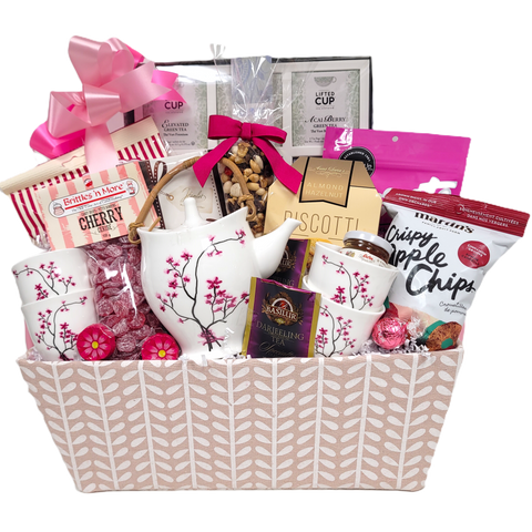 Anytime can be tea time with this pastel basket filled with a beautiful tea pot and matching cups and an assortment of teas nestled amongst lots of delicious sweet and salty treats to enjoy. There's biscuits, sweet candy, trail mix and more.&nbsp;&nbsp;