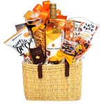 Beach bag gift basket filled with sweet treats and wine to savour.