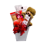 Nestled in this pretty tin is an assortment of chocolates, popcorn, nuts, cookies all adorned with a plush bear to add a touch of warmth.