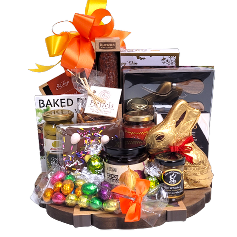 Our festive charcuterie board is filled to the brim with Easter chocolate treats, gourmet delights of olives, cheese, cheese toppers, salsa with cider, gourmet mustard, crackers, pretzels, smoked salmon, artisanal salami, pretzels and a beautiful cheese knife set.