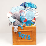 A handcrafted wooden toy cube gift basket filled with toys for baby, a sleeper, hooded towel and receiving blanket too.