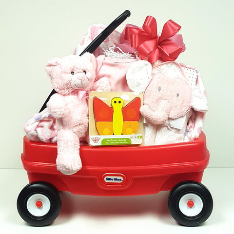 A perfect baby gift basket that comes with a little red wagon nestled with a plush baby blanket, onesie, hooded towel, cuddly teddy and classic baby puzzle.