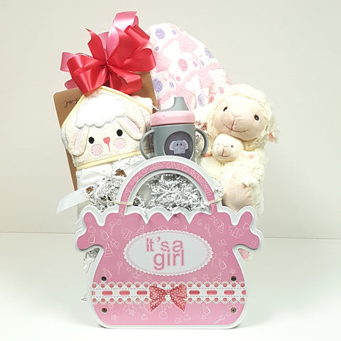 A keepsake baby wood crate gift box loaded it with a soft plush blanket and hooded towel, baby's first sippy cup and a mama with baby plush.
