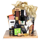 A beautiful cheese board and knife set holds a beautiful assortment of gourmet delights. There's specialty oil and vinegar, cheese, crackers, mustard, salmon, artisanal salami and of course some chocolate to enjoy.