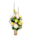 Beautiful floral vase arrangement with cream coloured roses, white hydrangea and lilies.