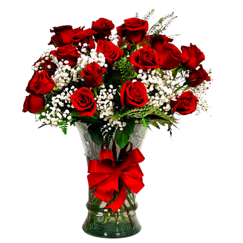 Beautiful floral arrangement of two dozen red roses with baby's breath in a large vase