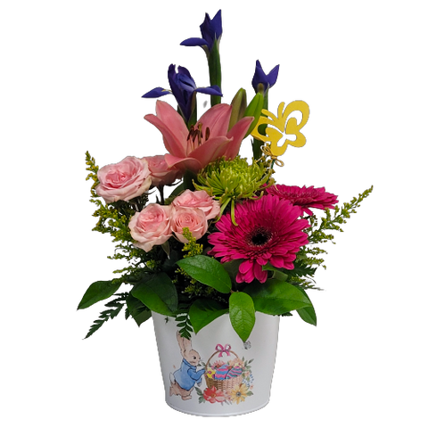 Pretty blooms of pinks, purple and greens are nestled in our keepsake Peter Cottontail pot. A delight to give and receive!