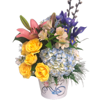 Say hello to spring with this beautiful arrangement of roses, hydrangea, lillies and more. Fresh and cheerful, this one is sure to brighten up someone's day!