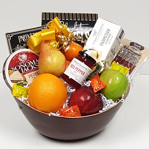 A delightful fruit gift basket filled with tantalizing savoury shortbread, red pepper jelly, cheese, pepperoni, sweet & salty snacks served up with fruit.