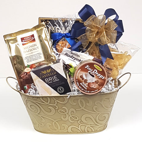 A vanilla colored swirl tin gift basket loaded with crackers, cheese, nuts, tasty chocolates, candies and more.