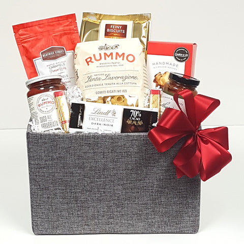 A  gourmet gift basket filled with delectables for the pantry such as pasta and Italian pasta sauce, there's antipasto, utterly delicious handmade shortbreads, chocolates and biscuits too.