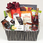 A pretty fabric gift basket containing a pizza grill stone, gourmet pizza sauce, Italian pasta sauce, Rummo pasta, Cider Keg apple cider, cheese, crackers and savoury shortbread to enjoy.