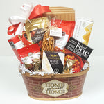A perfect housewarming gift basket with a chockfull of delectable treats complete with a cheese board to keep, pretzels and chocolates, crackers, cheese, smoked salmon and cookies to eat. 
