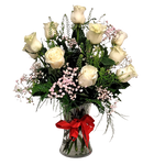 Vase of dozen white roses with greens and baby's breath.