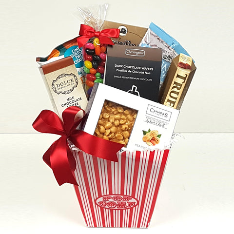 A beautiful sweet & salty gift basket filled with truffles, peanut brittle, wafer rolls, jelly beans, toffee peanuts and sweet potato chips.
