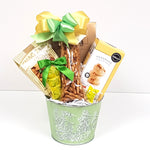 A pretty tin get well gift basket filled with lots of yummy sweet and salty snacks. 