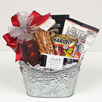 A pretty silver tin gift basket filled with licorice, truffles. Lindt chocolate, pretzels, gummy bears, potato chips and more.