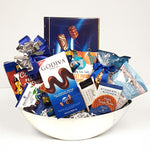 A pretty silver half moon container containing a delectable assortment of chocolates, nuts and chips too!