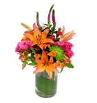 Bright & spicy floral arrangement in hues of orange, fuschia and greens with lilies, fugi mums, alstromeria and more.